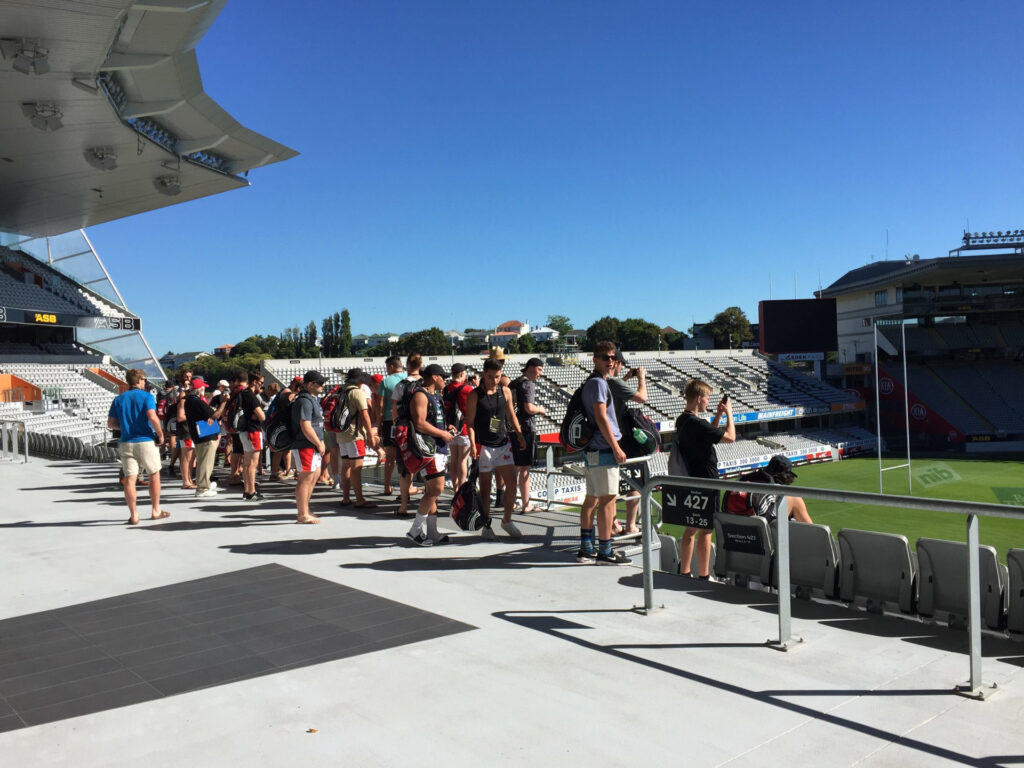 Group of people on a stadium tour at Eden Park