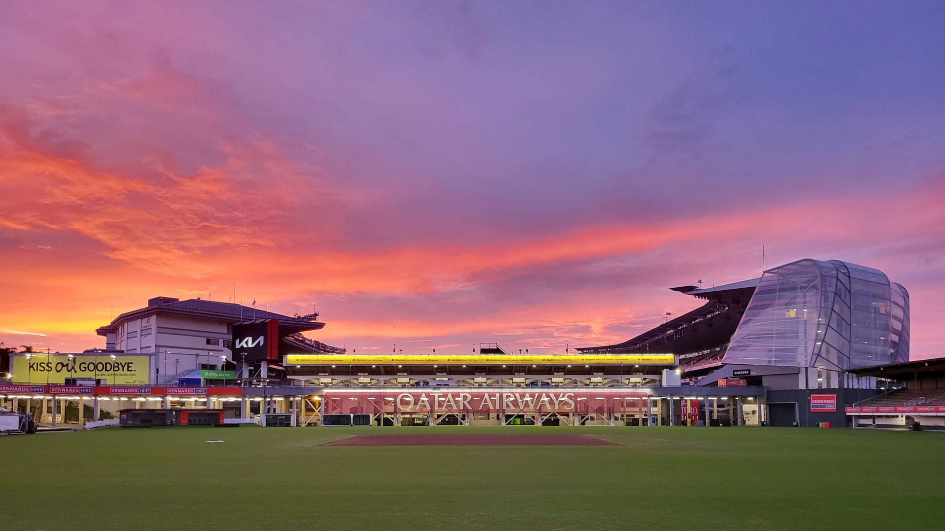 Eden Park at dusk with Qatar Airways signage shown